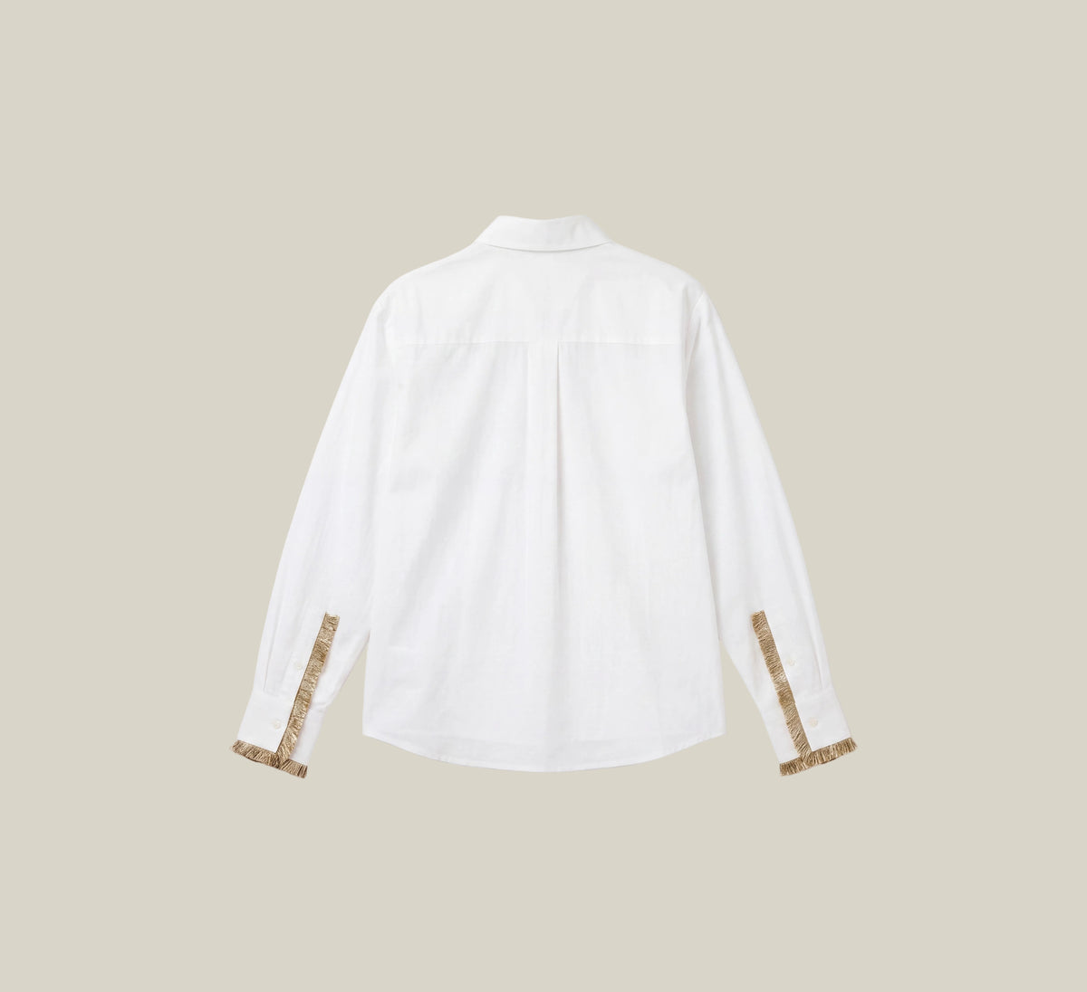 A white long-sleeve button-up shirt shown from the back, featuring decorative gold patterned cuffs, displayed on a clean white background with a beige border.