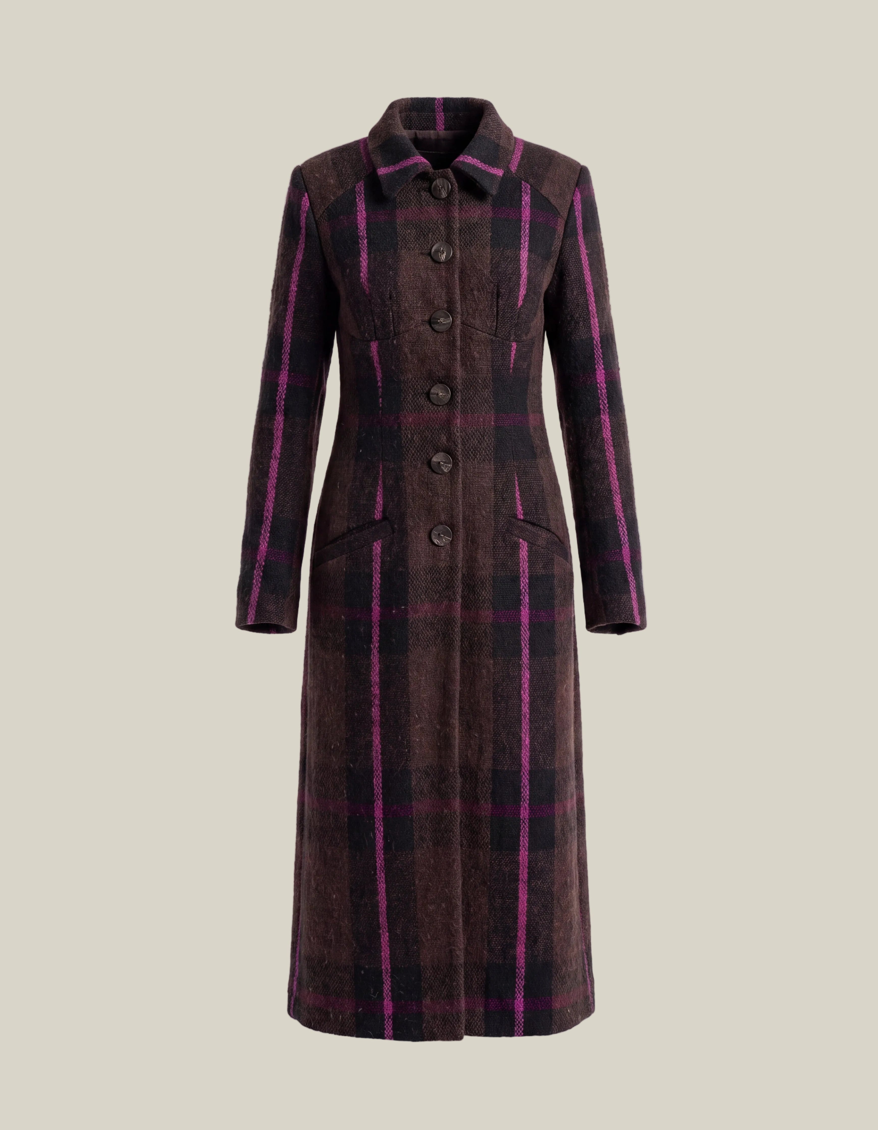 A long-line plaid coat in dark brown and black with vibrant magenta pink stripes, featuring a button-front closure and a classic collar, shown on a plain light gray background.