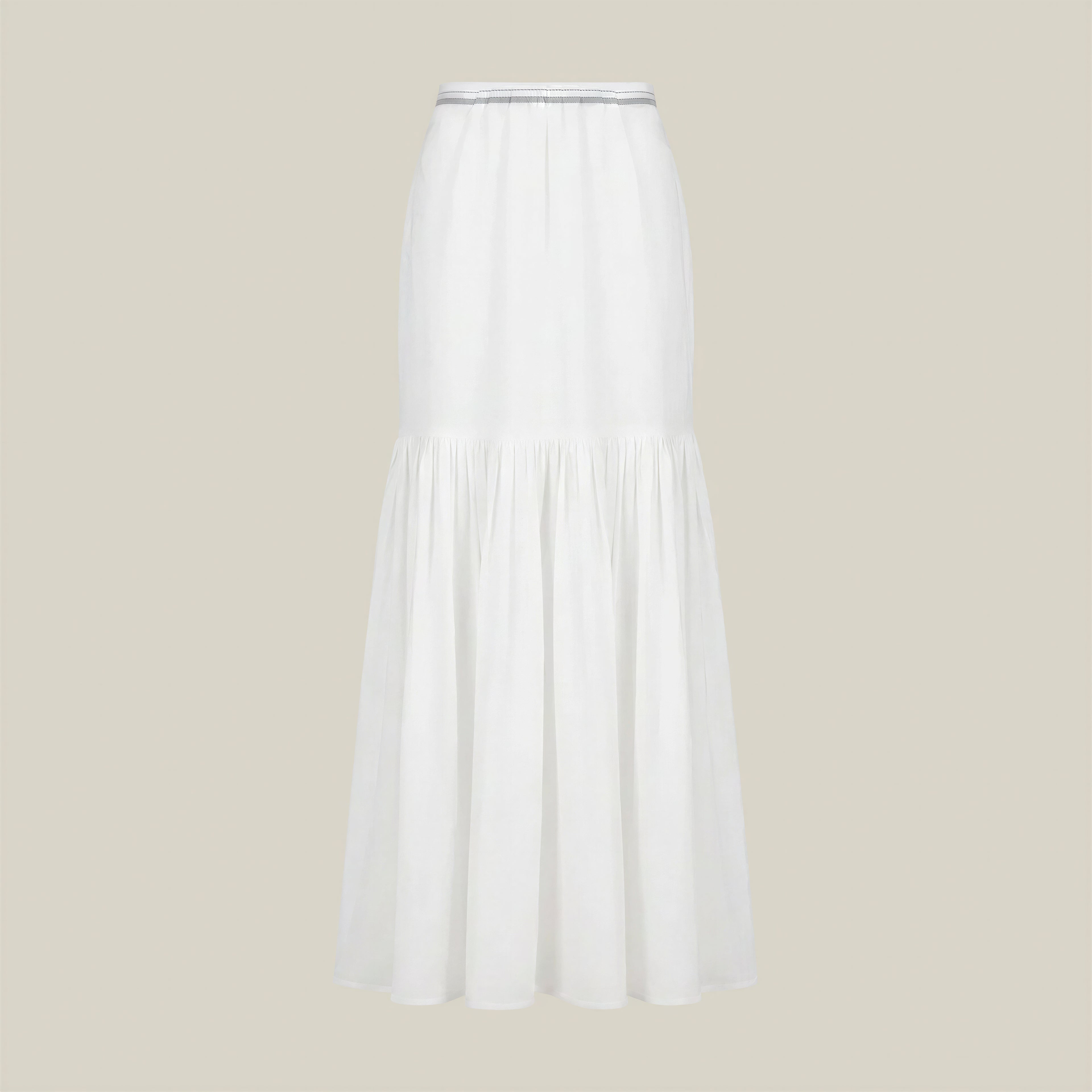 A white tiered midi skirt with a gathered waistband, displayed on a neutral beige background.